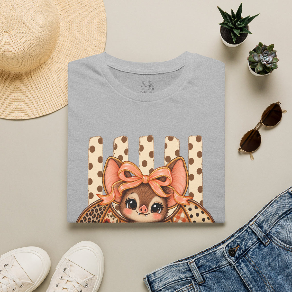 Cute Bat Tee — Adorable Bat with Bow Graphic T-Shirt (Leopard Striped Background)