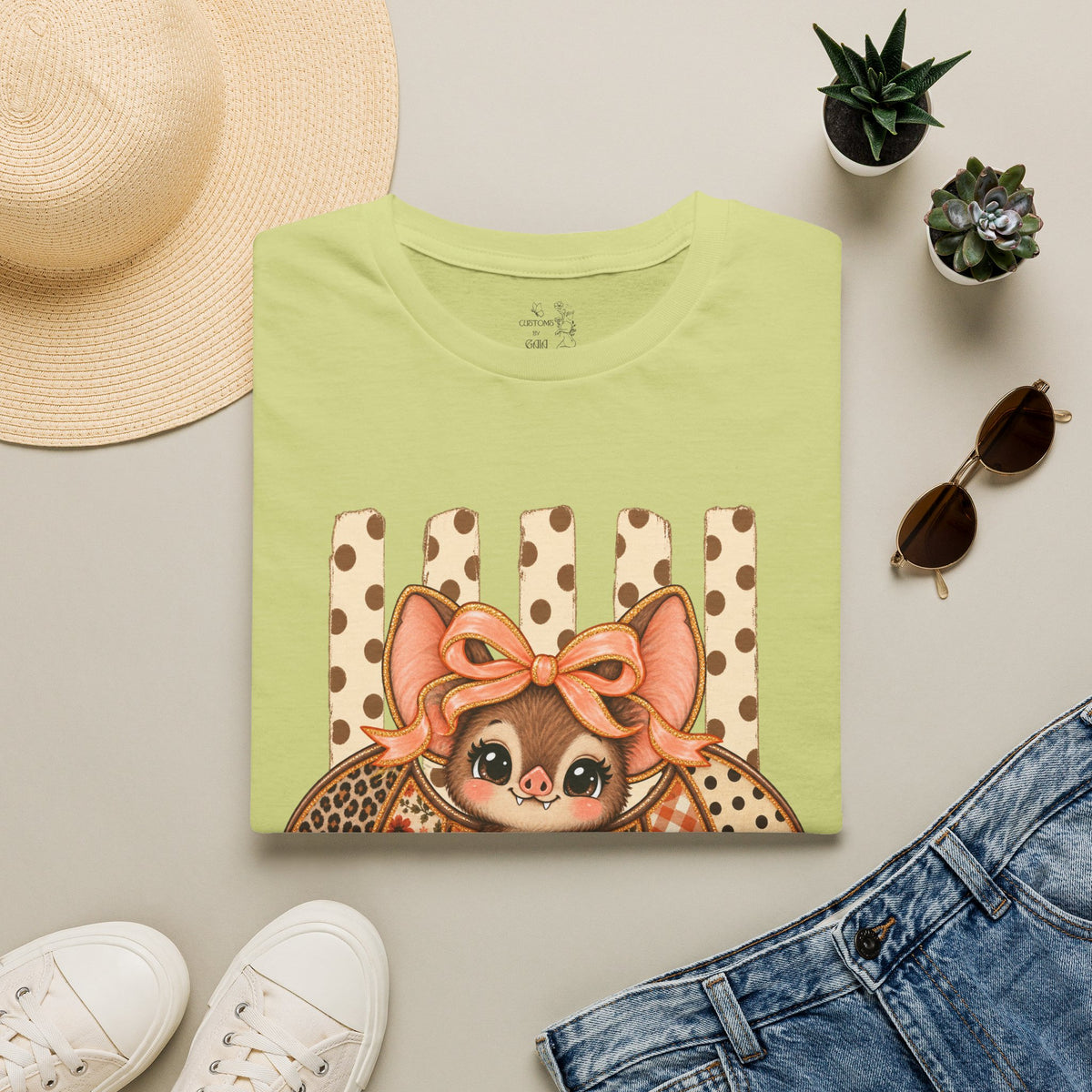 Cute Bat Tee — Adorable Bat with Bow Graphic T-Shirt (Leopard Striped Background)