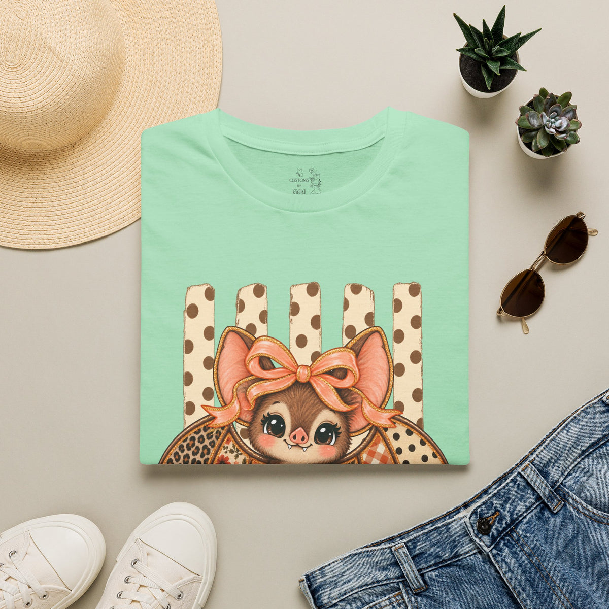 Cute Bat Tee — Adorable Bat with Bow Graphic T-Shirt (Leopard Striped Background)