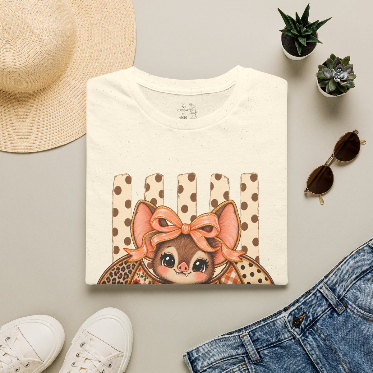 Cute Bat Tee — Adorable Bat with Bow Graphic T-Shirt (Leopard Striped Background)