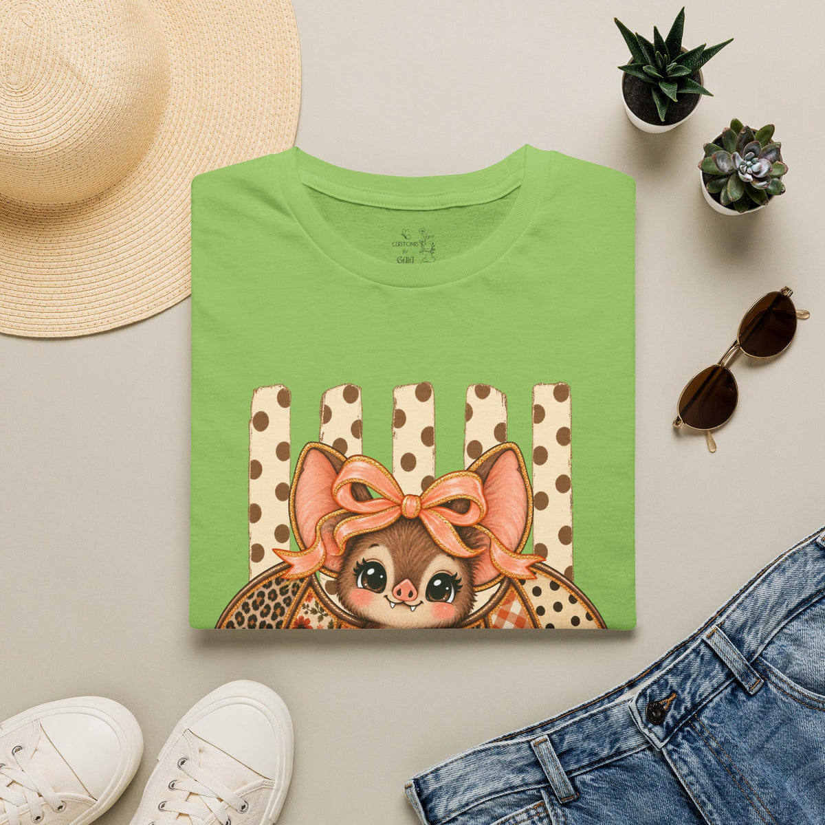 Cute Bat Tee — Adorable Bat with Bow Graphic T-Shirt (Leopard Striped Background)